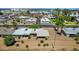 Aerial view showcasing a well-maintained neighborhood with desert landscaping, mature trees, and proximity to local amenities at 10429 W Oakmont Dr, Sun City, AZ 85351