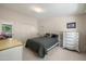 Comfortable bedroom with dresser and closet storage, featuring a grey bed set at 10429 W Oakmont Dr, Sun City, AZ 85351