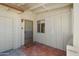 Inviting entryway features a tiled floor and protective storm door, complemented by white trim at 10429 W Oakmont Dr, Sun City, AZ 85351