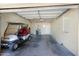 Spacious garage featuring an electric golf cart, offering convenience and easy access for golf enthusiasts at 10429 W Oakmont Dr, Sun City, AZ 85351