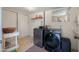 Functional laundry room featuring modern appliances, ample storage, and a clean, organized space at 10429 W Oakmont Dr, Sun City, AZ 85351