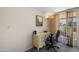 Cozy office space featuring a functional desk, plush chair, and sliding door to patio at 10429 W Oakmont Dr, Sun City, AZ 85351
