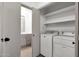 Convenient laundry room leads to bathroom with vanity and ample storage at 1126 W Elliot Rd # 2040, Chandler, AZ 85224