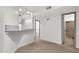 Spacious living area with modern finishes, flowing into a functional kitchen and bathroom at 1126 W Elliot Rd # 2040, Chandler, AZ 85224