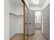 Spacious walk-in closet features mirrored doors and open view to neutral-toned bathroom at 1126 W Elliot Rd # 2040, Chandler, AZ 85224