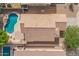 Birds eye view features house with tile roof, swimming pool, stone decking, and a mature tree at 11359 E Elena Ave, Mesa, AZ 85208