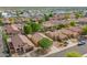 An aerial view of a desert community with neatly arranged homes, desert landscaping, and community streets at 11359 E Elena Ave, Mesa, AZ 85208