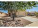 Attractive home showcasing desert landscaping and a two-car garage at 11359 E Elena Ave, Mesa, AZ 85208