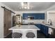 Stylish kitchen with stainless appliances, a barn door, an island with counter seating at 11359 E Elena Ave, Mesa, AZ 85208
