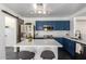 Stylish kitchen with stainless appliances, a barn door, an island with counter seating at 11359 E Elena Ave, Mesa, AZ 85208