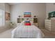 This bedroom features neutral carpet, artwork, and built in shelving around the headboard at 11651 E Appaloosa Pl, Scottsdale, AZ 85259