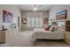 Serene bedroom featuring plantation shutters, neutral decor, and ample natural light at 11651 E Appaloosa Pl, Scottsdale, AZ 85259