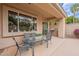 Covered patio featuring an outdoor dining area and built-in grill at 11651 E Appaloosa Pl, Scottsdale, AZ 85259
