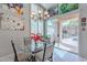 Bright dining area with modern chandelier and sliding glass doors to the backyard patio at 11651 E Appaloosa Pl, Scottsdale, AZ 85259