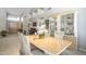 Open-concept dining room with table set, display cabinet, and natural light at 11651 E Appaloosa Pl, Scottsdale, AZ 85259