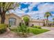 Elegant home showcasing lush landscaping, a well-manicured lawn, and a three-car garage at 11651 E Appaloosa Pl, Scottsdale, AZ 85259