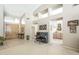 Inviting foyer with high ceilings, piano, and art, leading into the rest of the home at 11651 E Appaloosa Pl, Scottsdale, AZ 85259