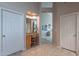 Hallway with views of a powder room and bedroom at 11651 E Appaloosa Pl, Scottsdale, AZ 85259