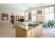 Open-concept living room and kitchen with high ceilings and lots of natural light at 11651 E Appaloosa Pl, Scottsdale, AZ 85259