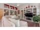 Comfortable living room featuring built-in shelving and a media center, perfect for Gathering time and relaxation at 11651 E Appaloosa Pl, Scottsdale, AZ 85259