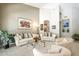 Comfortable living room showing plush seating, stylish art, and unique architectural details at 11651 E Appaloosa Pl, Scottsdale, AZ 85259