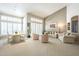 Bright, open-concept living room and dining area with plantation shutters and elegant furnishings at 11651 E Appaloosa Pl, Scottsdale, AZ 85259
