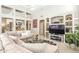 Comfortable living room with built in shelves and bar area for entertaining at 11651 E Appaloosa Pl, Scottsdale, AZ 85259