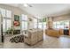 Spacious living room with fireplace and large windows that let in plenty of natural light at 11651 E Appaloosa Pl, Scottsdale, AZ 85259