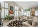 Inviting living room with plenty of seating and natural light from large windows and sliding doors at 11651 E Appaloosa Pl, Scottsdale, AZ 85259