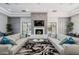 Comfortable seating area with plush sofas and a modern fireplace at 11651 E Appaloosa Pl, Scottsdale, AZ 85259