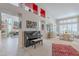 Open-concept living space showcasing a grand piano, dining area, and stylish decor with great natural light at 11651 E Appaloosa Pl, Scottsdale, AZ 85259