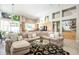 Open living room featuring sectional sofa, high ceilings, and artful decor, leading into the kitchen at 11651 E Appaloosa Pl, Scottsdale, AZ 85259