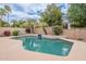 Sparkling backyard pool with lush landscaping, privacy wall, and tranquil atmosphere at 11651 E Appaloosa Pl, Scottsdale, AZ 85259