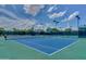 Well-maintained tennis court with green and blue surface at 11651 E Appaloosa Pl, Scottsdale, AZ 85259
