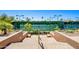 View of tennis courts accessible by steps, surrounded by landscaping at 11651 E Appaloosa Pl, Scottsdale, AZ 85259
