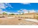 Expansive backyard featuring desert landscaping, concrete slabs, and a secure fence at 12805 W Colter St, Litchfield Park, AZ 85340