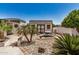 Desert-landscaped backyard with a metal storage shed and outdoor dining area at 12805 W Colter St, Litchfield Park, AZ 85340