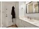 Well-lit bathroom with marble-look counters, tiled floors, and a medicine cabinet mirror at 12805 W Colter St, Litchfield Park, AZ 85340