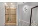 Bathroom featuring tiled floors, glass shower and decorative art at 12805 W Colter St, Litchfield Park, AZ 85340