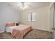 Comfortable bedroom with carpet, large window, and ample natural light at 12805 W Colter St, Litchfield Park, AZ 85340