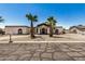 Inviting single-Gathering home featuring a private driveway and low-maintenance desert landscaping under a clear blue sky at 12805 W Colter St, Litchfield Park, AZ 85340