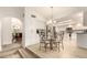 Eat-in kitchen with stainless appliances, granite countertops, and adjacent dining area for casual meals at 12805 W Colter St, Litchfield Park, AZ 85340