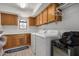 Functional laundry room featuring front loading washer, dryer, and storage cabinets at 12805 W Colter St, Litchfield Park, AZ 85340