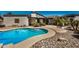 Inviting backyard pool with a tanning ledge and beautiful landscaping with room for entertaining at 12805 W Colter St, Litchfield Park, AZ 85340