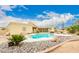 Outdoor pool surrounded by desert landscaping and patio space, great for relaxation and entertaining at 12805 W Colter St, Litchfield Park, AZ 85340