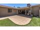 Well-maintained backyard with covered patio, artificial turf, and ample outdoor space for entertaining at 13608 W Aleppo Dr, Sun City West, AZ 85375