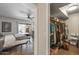 Comfortable bedroom featuring wood floors, ceiling fan and walk in closet for ample storage space at 13608 W Aleppo Dr, Sun City West, AZ 85375