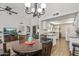 Open dining area with seamless flow into living room and kitchen, providing a bright, airy feel at 13608 W Aleppo Dr, Sun City West, AZ 85375