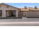 Photo featuring the attached garage with storage cabinets, providing secure parking at 13608 W Aleppo Dr, Sun City West, AZ 85375