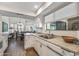 Kitchen area with wooden floors, granite countertops, and stainless steel appliances at 13608 W Aleppo Dr, Sun City West, AZ 85375